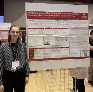 Alex Oberyszyn standing by her poster, which was presented at the CTSI conference. 