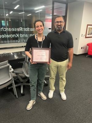 Alexa Plotkin receiving award for Best Staff Poster in the Recovery section